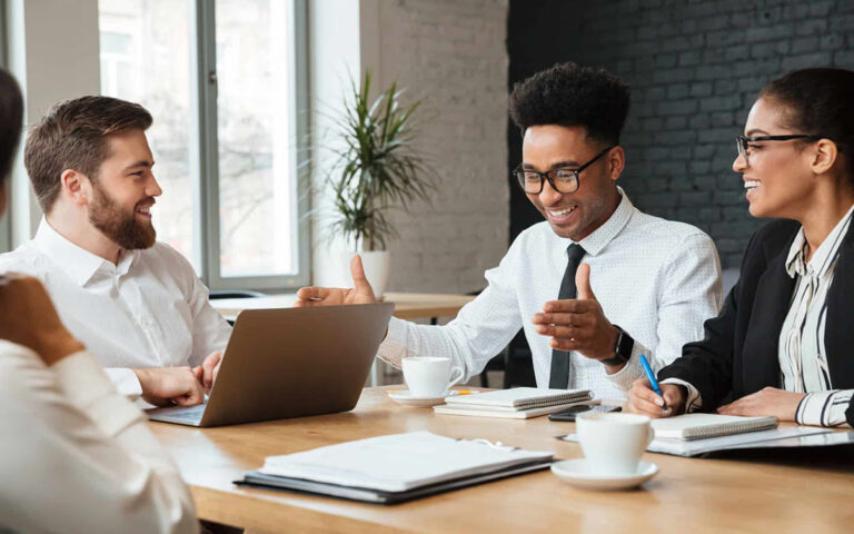team smiling during client presentation