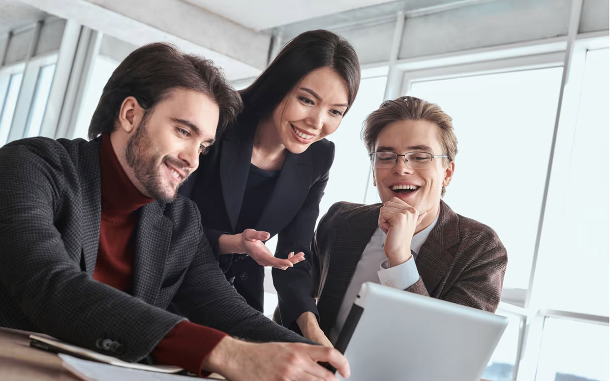 team smiling with a successful project