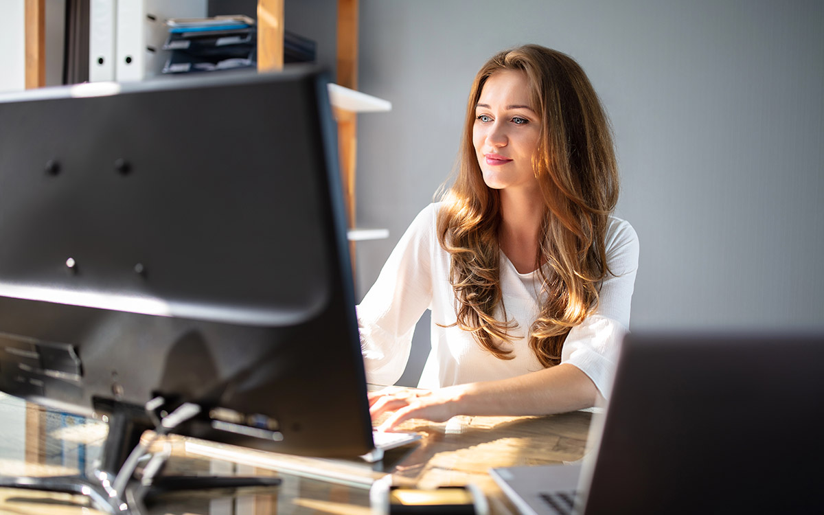 woman working on her computer at the office