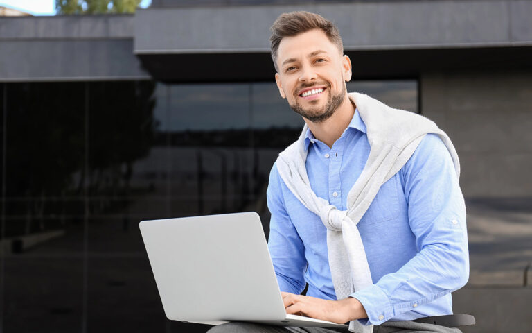 businessman with a laptop working outdoors