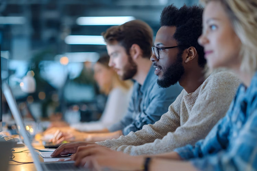 multiple team members working at the office