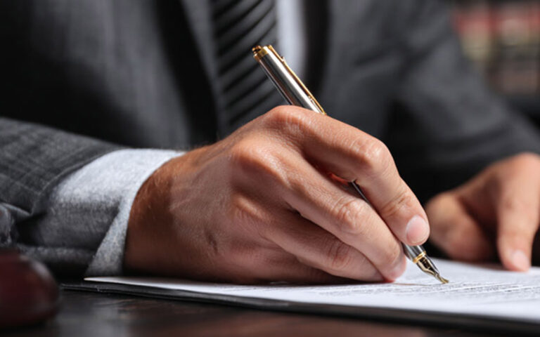 lawyer signing some documents