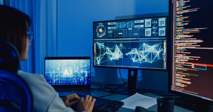 woman working with multiple screens