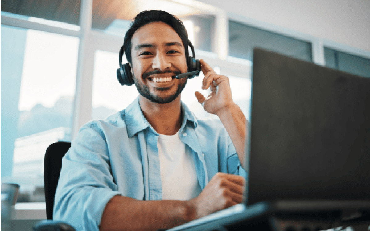 man smiling taking a support call