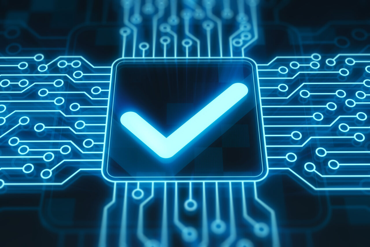 A glowing blue checkmark on a digital circuit board chip against a dark background, representing IT compliance and verification.